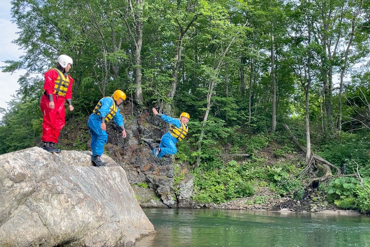 Diving into the Sisorapci River on a Daisetsuzan Hiking adventure