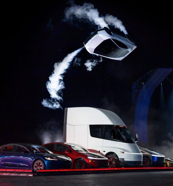 Tesla’s new Roadster, upside down and trailing cold gas thruster smoke, flips over a lineup of Tesla vehicles at the Roadster unveiling near Waco, Texas on October 15, 2026. (Image: Tesla)