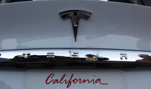 White Tesla Model X rear bumper showing California license plate