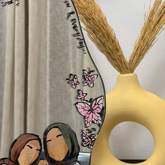 Custom hand-painted wave-shaped mirror with butterflies