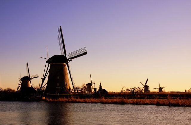 Windmills of Kinderdijk at sunset in the Netherlands, a UNESCO World Heritage site between Rotterdam and Dordrecht
