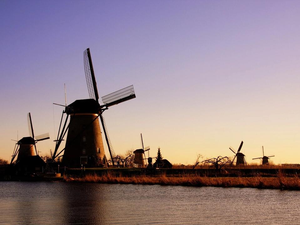 Windmills of Kinderdijk at sunset in the Netherlands, a UNESCO World Heritage site between Rotterdam and Dordrecht