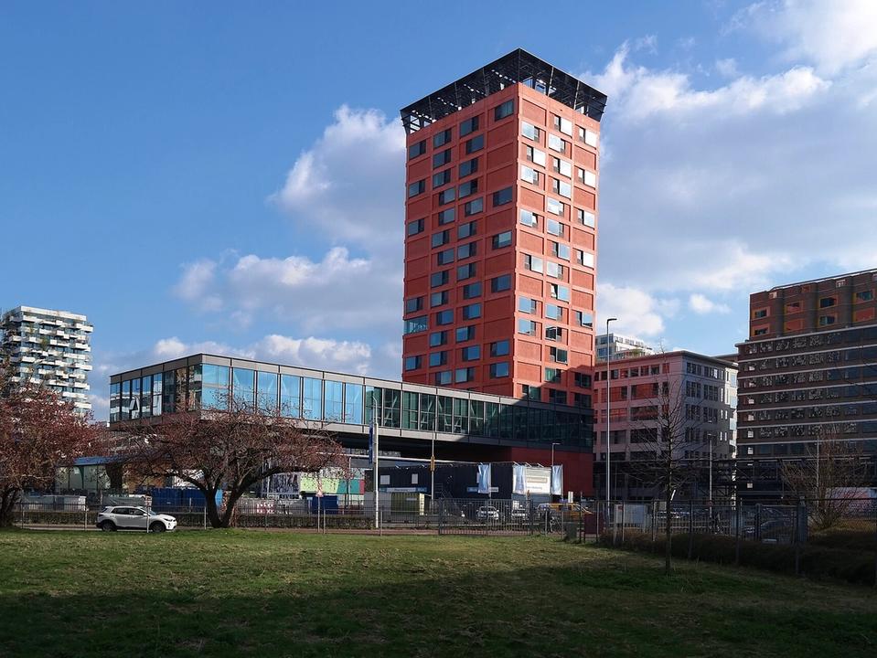 New residential towers under construction in the Strijp-S district of Eindhoven, with the Trudo tower and the Haasje Over building in view