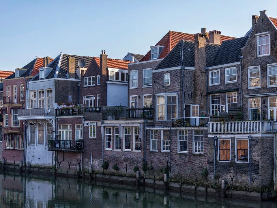 Historic canal houses backing directly onto the Voorstraathaven in Dordrecht's city centre