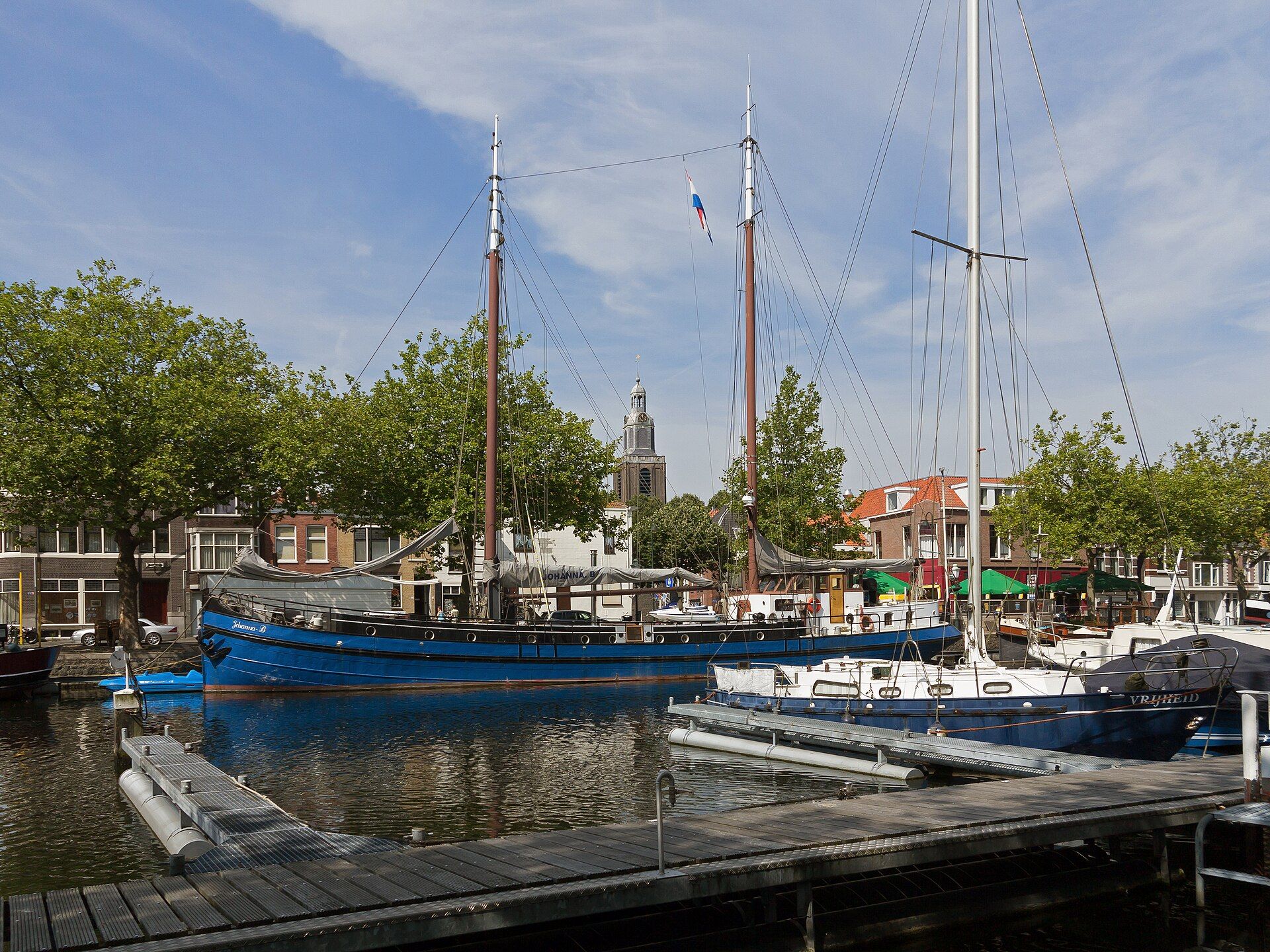 View over the harbour of Vlaardingen with the tower of the Grote Kerk in the background
