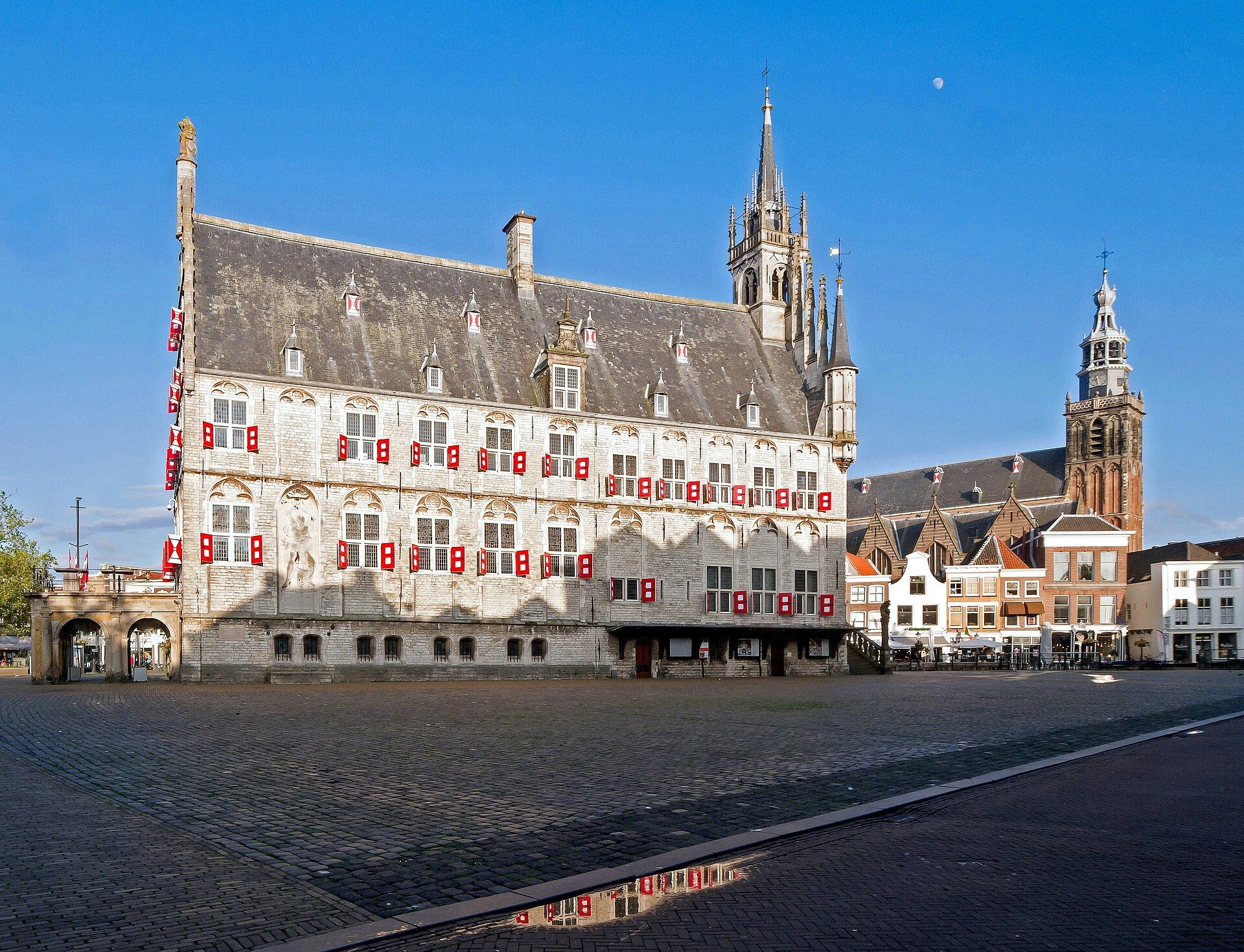 Gouda's Markt square with the medieval city hall and Sint-Janskerk tower on a clear day