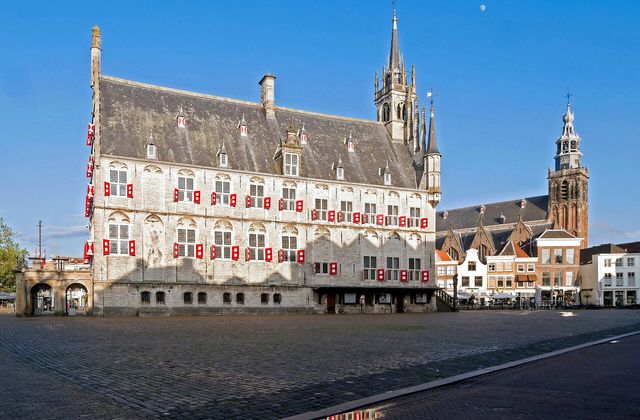 Gouda's Markt square with the medieval city hall and Sint-Janskerk tower on a clear day