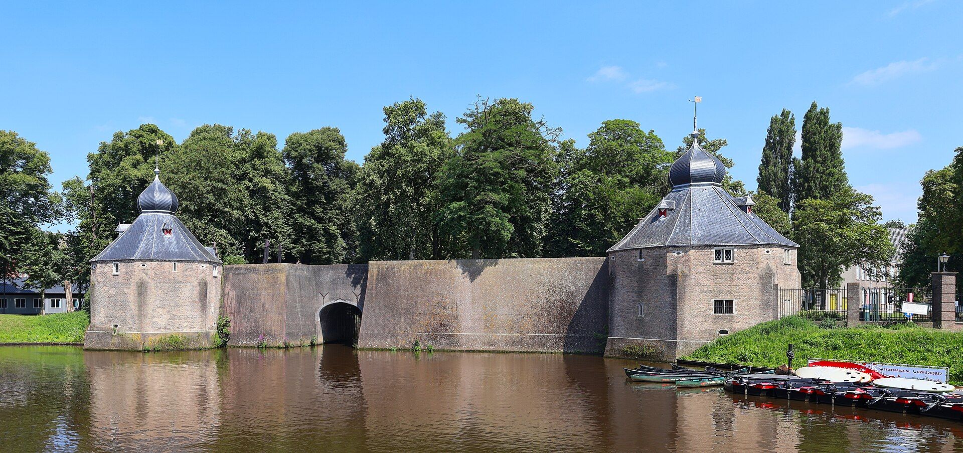 Historic Spanjaardsgat water gate seen across the harbour in central Breda