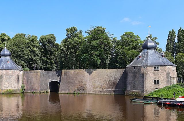Historic Spanjaardsgat water gate seen across the harbour in central Breda