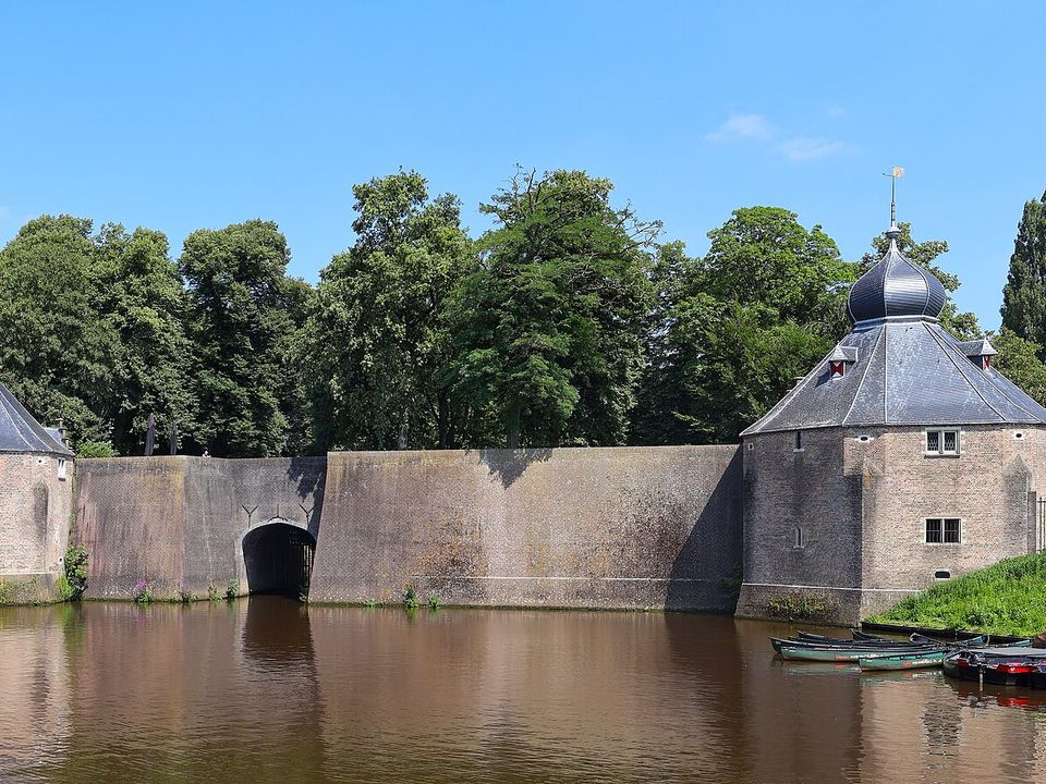 Historic Spanjaardsgat water gate seen across the harbour in central Breda