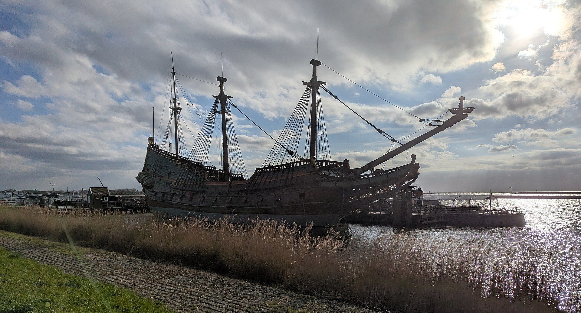 The Batavia museum ship moored in Bataviahaven, Lelystad, with the waterfront apartments of the harbour district behind it
