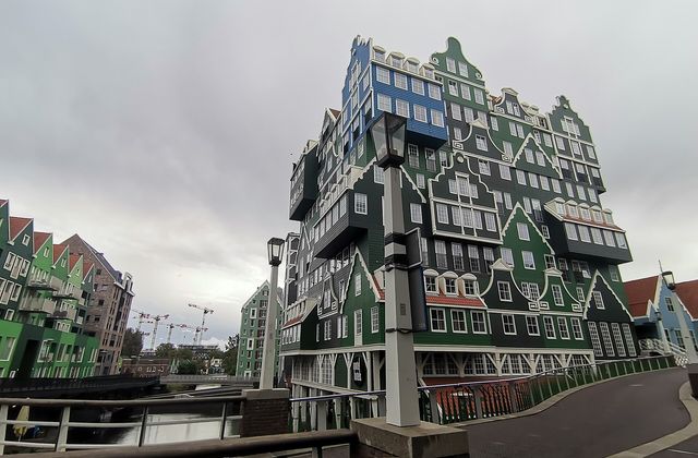 The stacked green Zaanse house facades of the Inntel hotel beside Zaandam station, the centrepiece of the Inverdan city centre rebuild