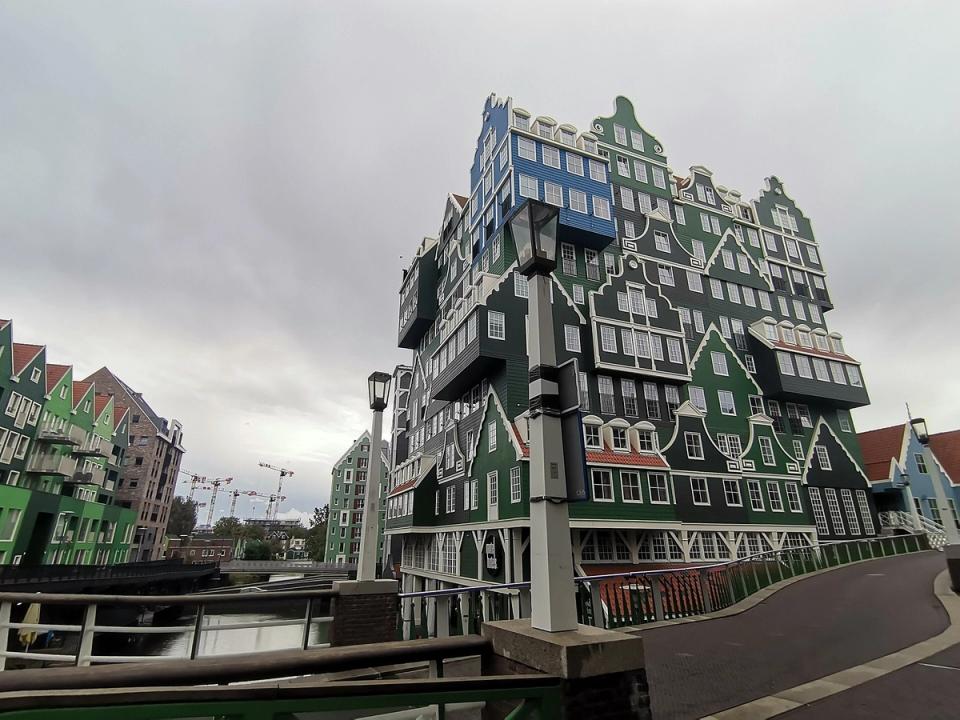 The stacked green Zaanse house facades of the Inntel hotel beside Zaandam station, the centrepiece of the Inverdan city centre rebuild