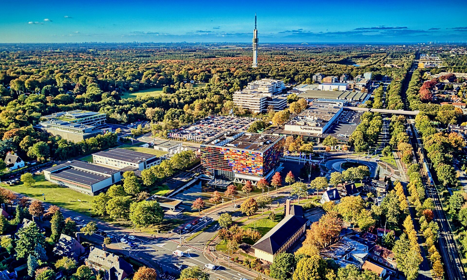 Aerial view of the Media Park broadcasting complex surrounded by trees in Hilversum