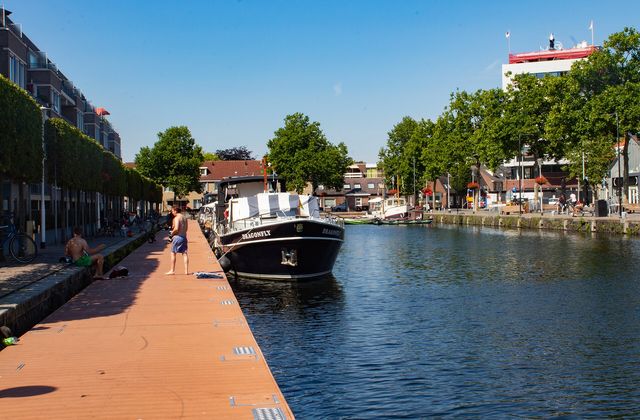 Waterfront apartments and boats along the Piushaven harbour in Tilburg in summer