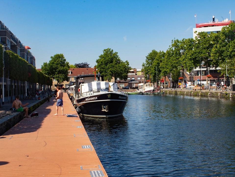Waterfront apartments and boats along the Piushaven harbour in Tilburg in summer