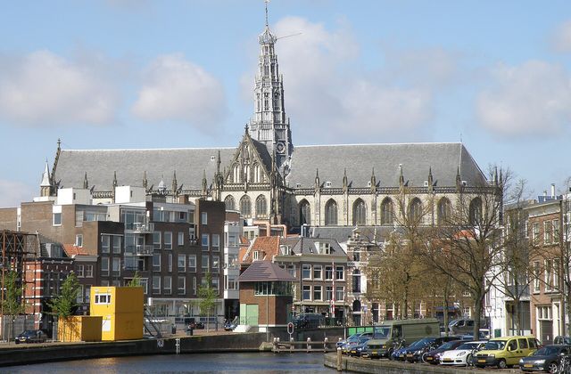 The Spaarne river in Haarlem with the Grote of Sint-Bavokerk rising above the old town rooftops