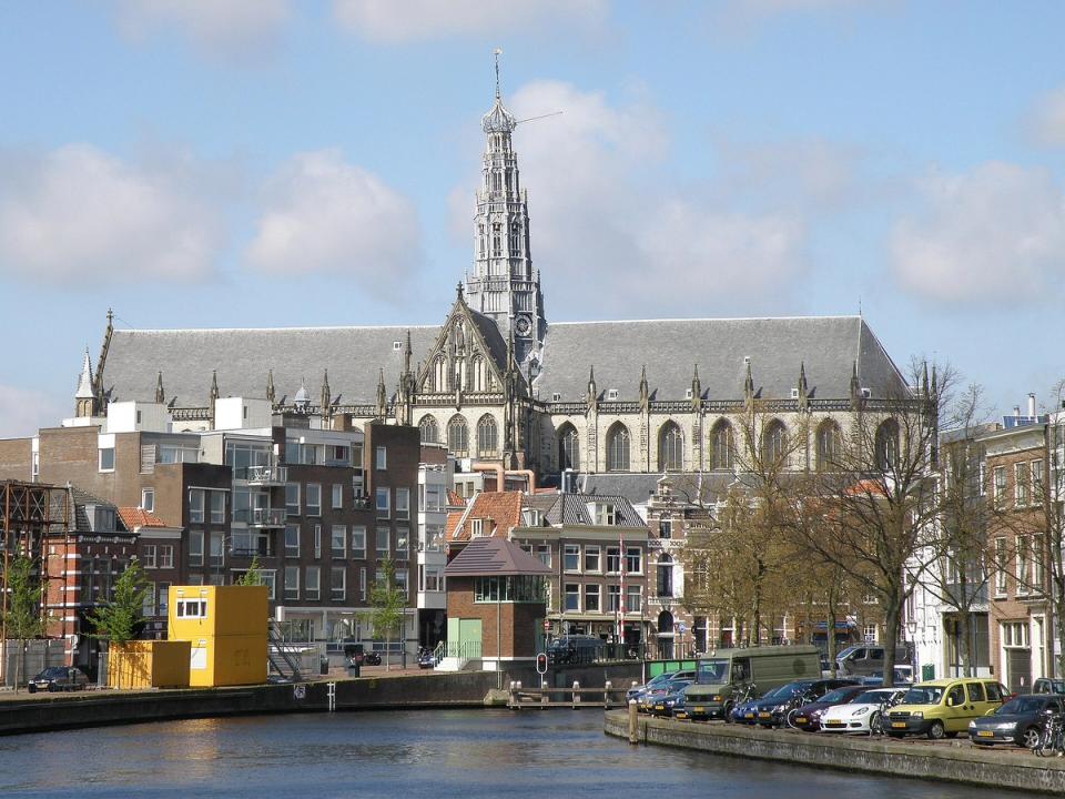 The Spaarne river in Haarlem with the Grote of Sint-Bavokerk rising above the old town rooftops