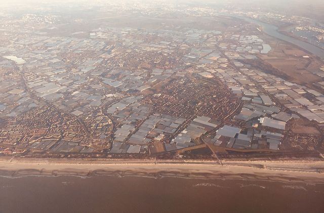 Aerial view of the glass greenhouses covering the Westland region in the Netherlands