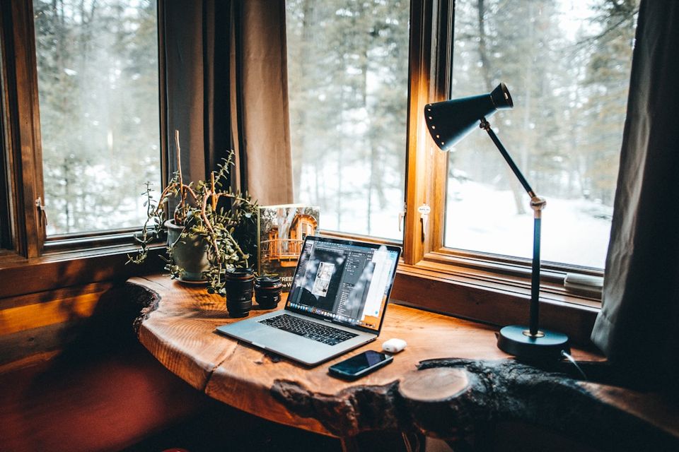 Homeowner reviewing a property guidebook report on a laptop