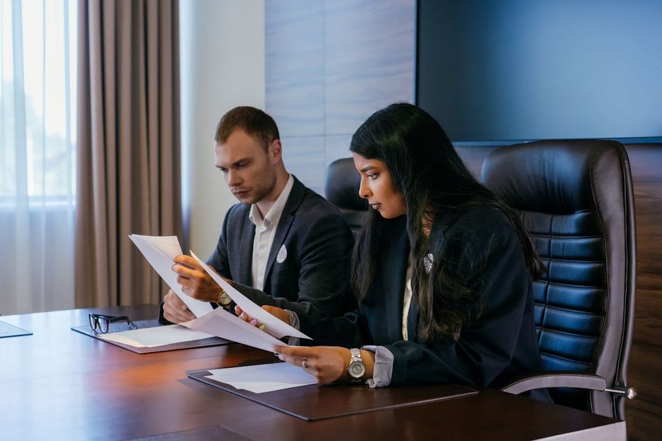 Investor conducting quarterly document review across multiple rental properties