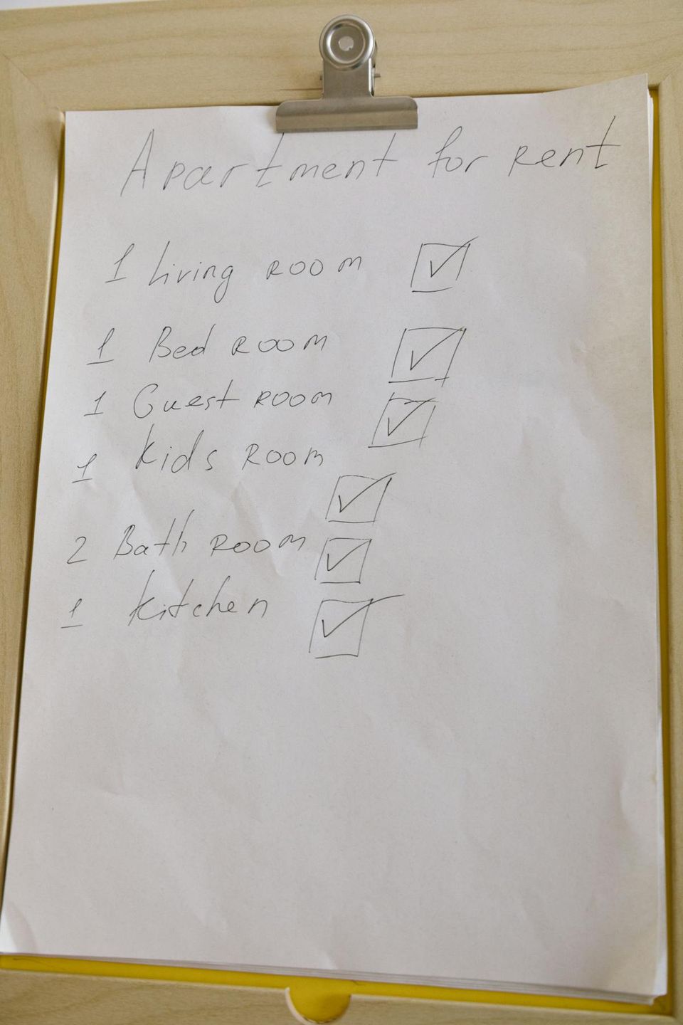 Seller's home inspection preparation checklist pinned to a kitchen bulletin board