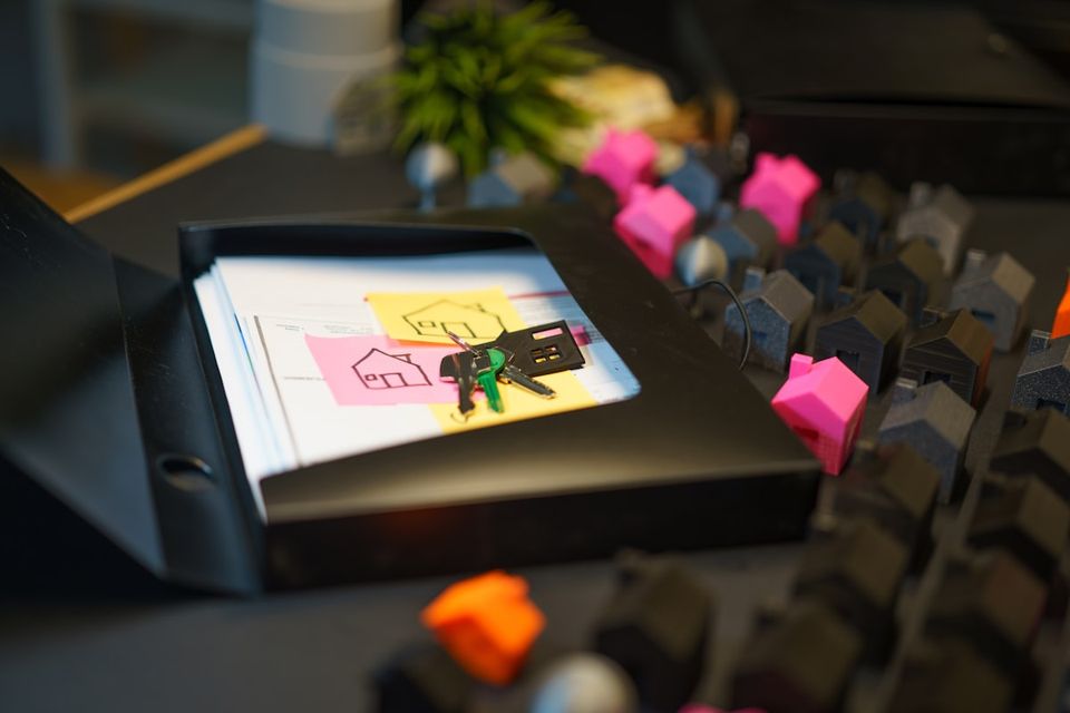 Closing folder with deed and title insurance policy as proof of ownership documents for a house