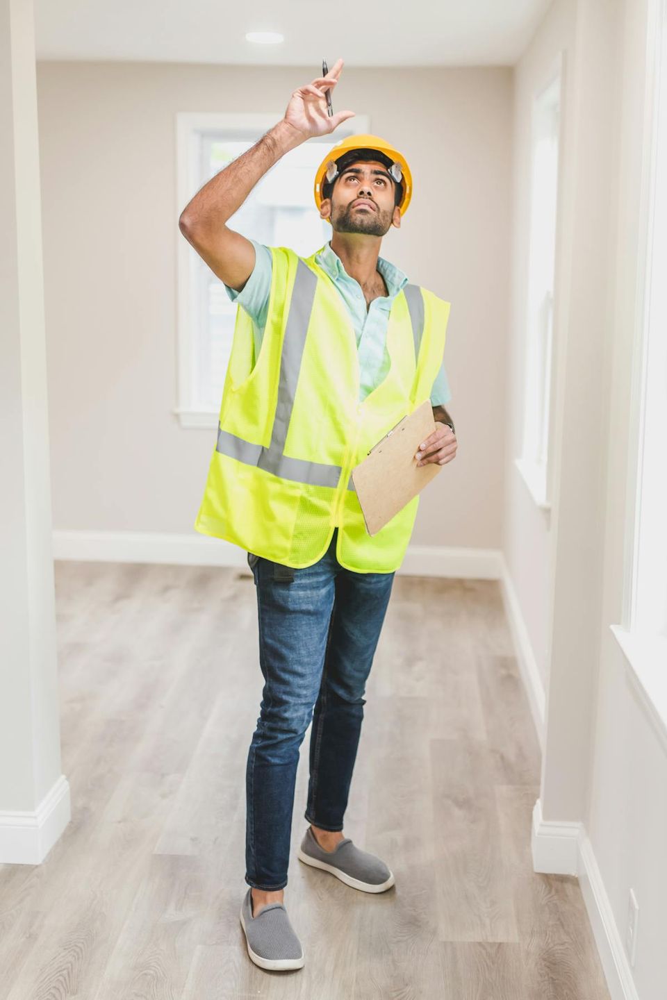Homeowner reviewing construction contract and punch list template before final walkthrough on a new home