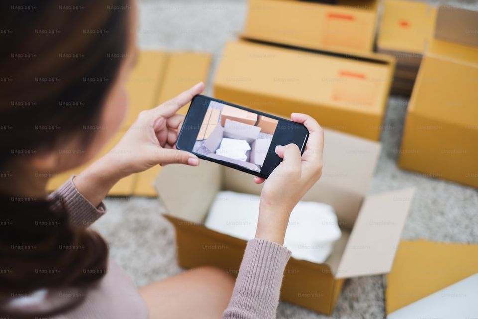 Homeowner taking photos of belongings for home insurance inventory documentation