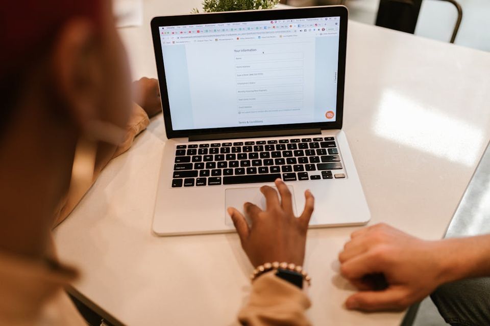 New homeowner registering appliance warranties on a laptop