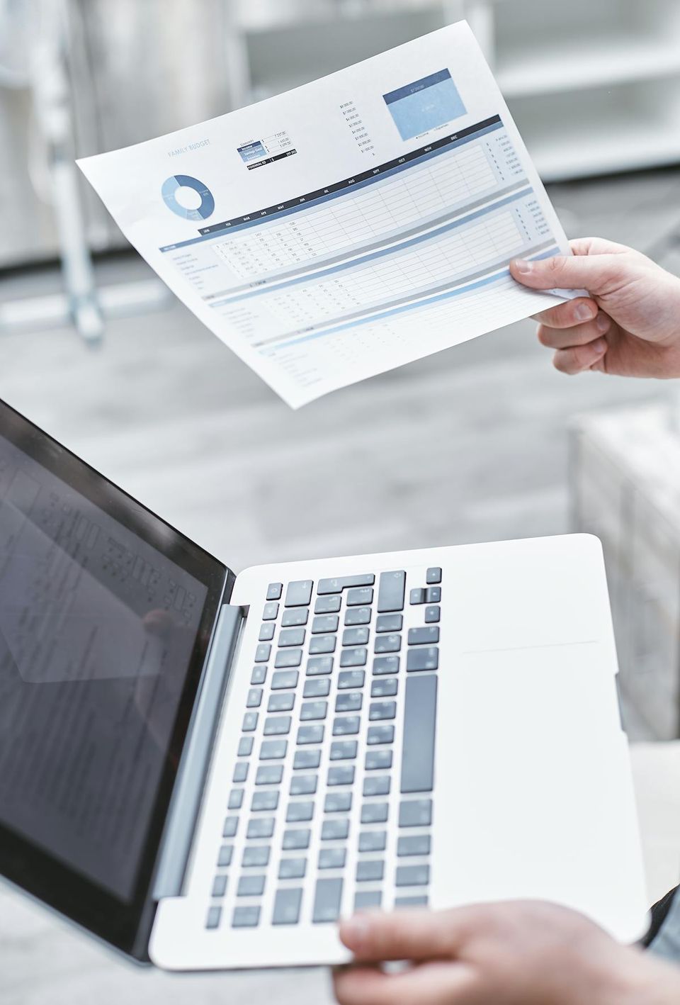 Homeowner reviewing organized property records on a laptop before listing their home