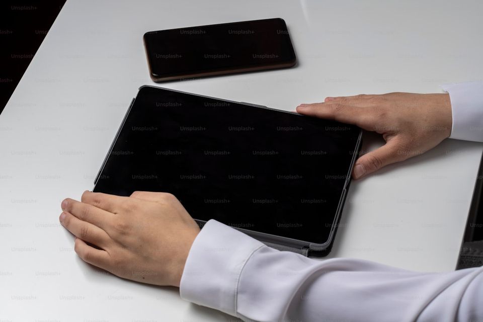 A homeowner scanning property documents into a tablet for digital storage