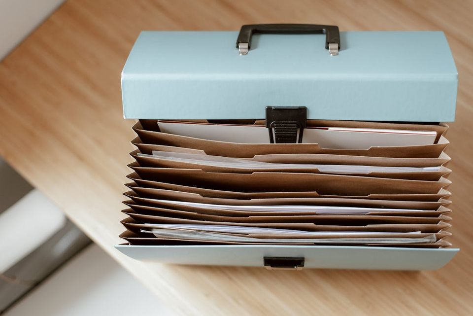 Organized home documentation and inspection reports laid out for a property record review