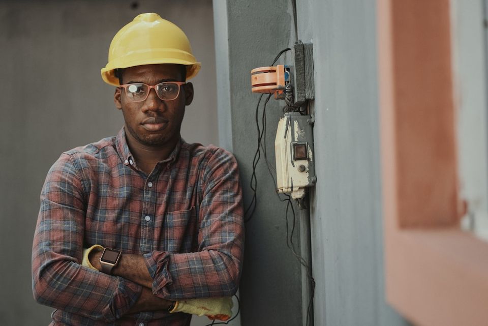 HVAC technician performing seasonal tune-up with diagnostic readings for service history log