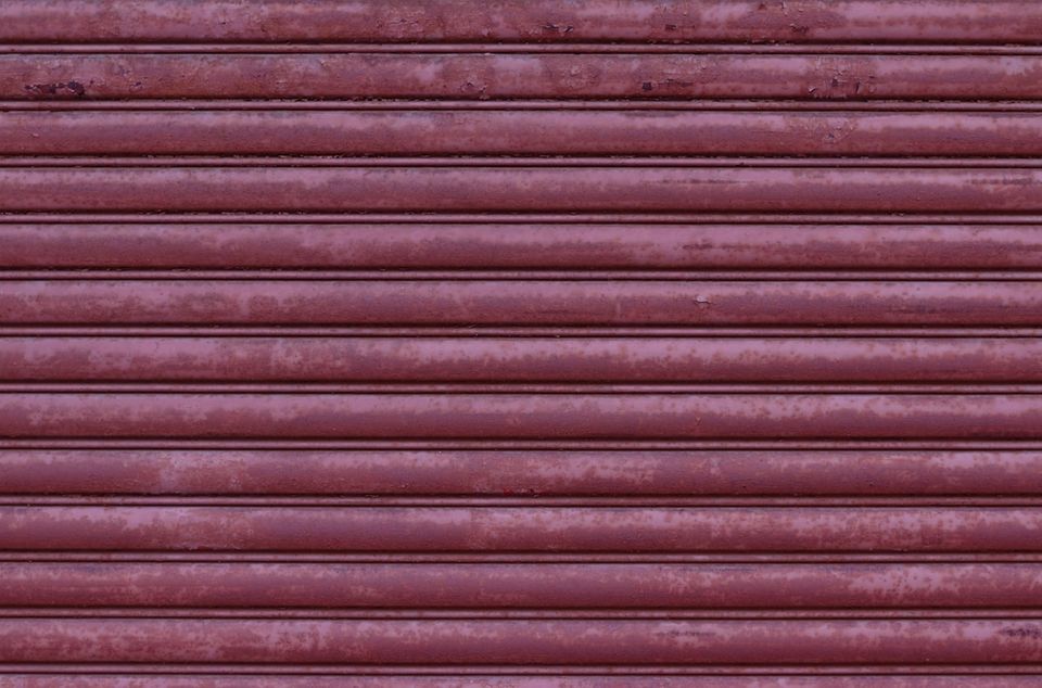 Comparison of torsion versus extension garage door springs with lifespan and cost data