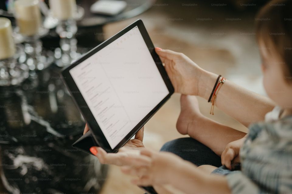 Homeowner conducting annual home document review with organized digital records on tablet