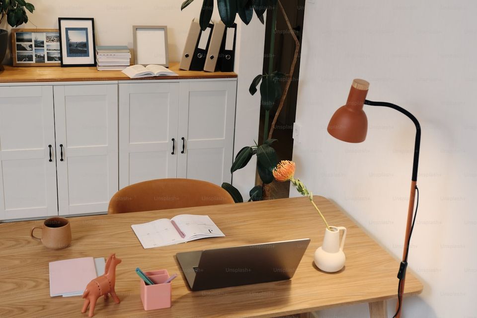 New homeowner&#39;s organized document station with filing system and laptop for digital records