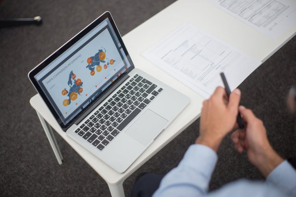 Side-by-side comparison of two transaction management platforms on a screen for a real estate agent