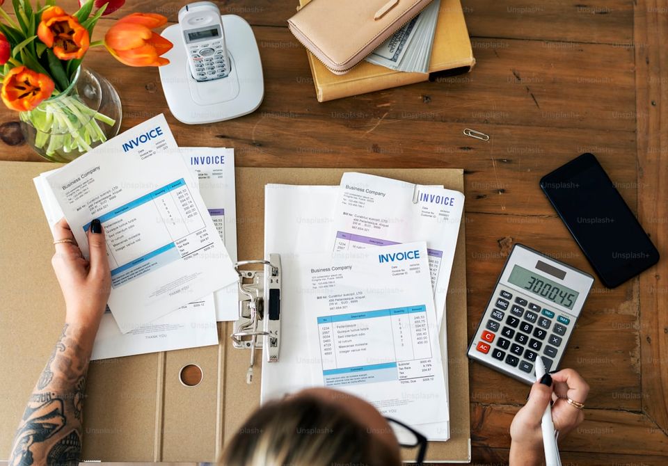Self-employed borrower organizing tax returns and bank statements for mortgage application