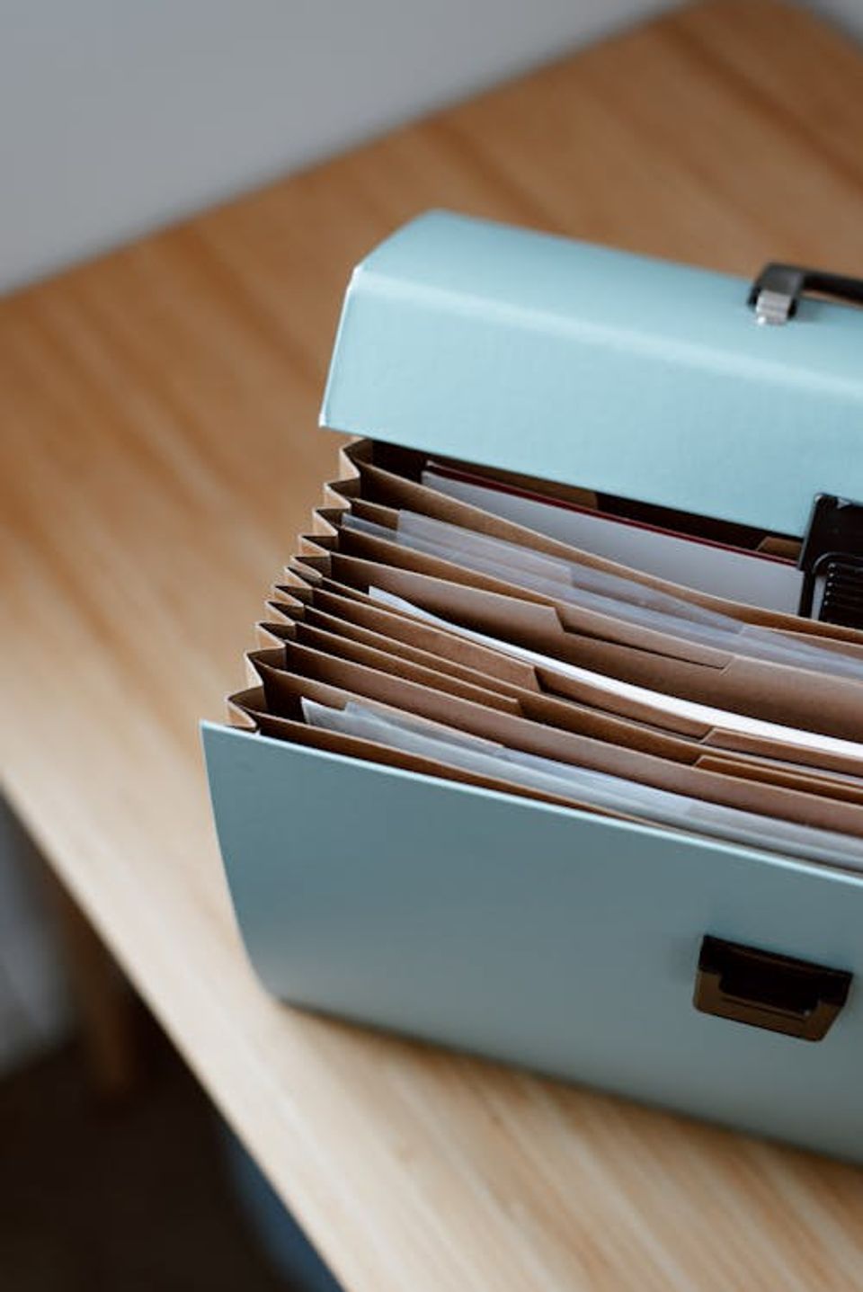 Organized home filing system with labeled folders for property documents