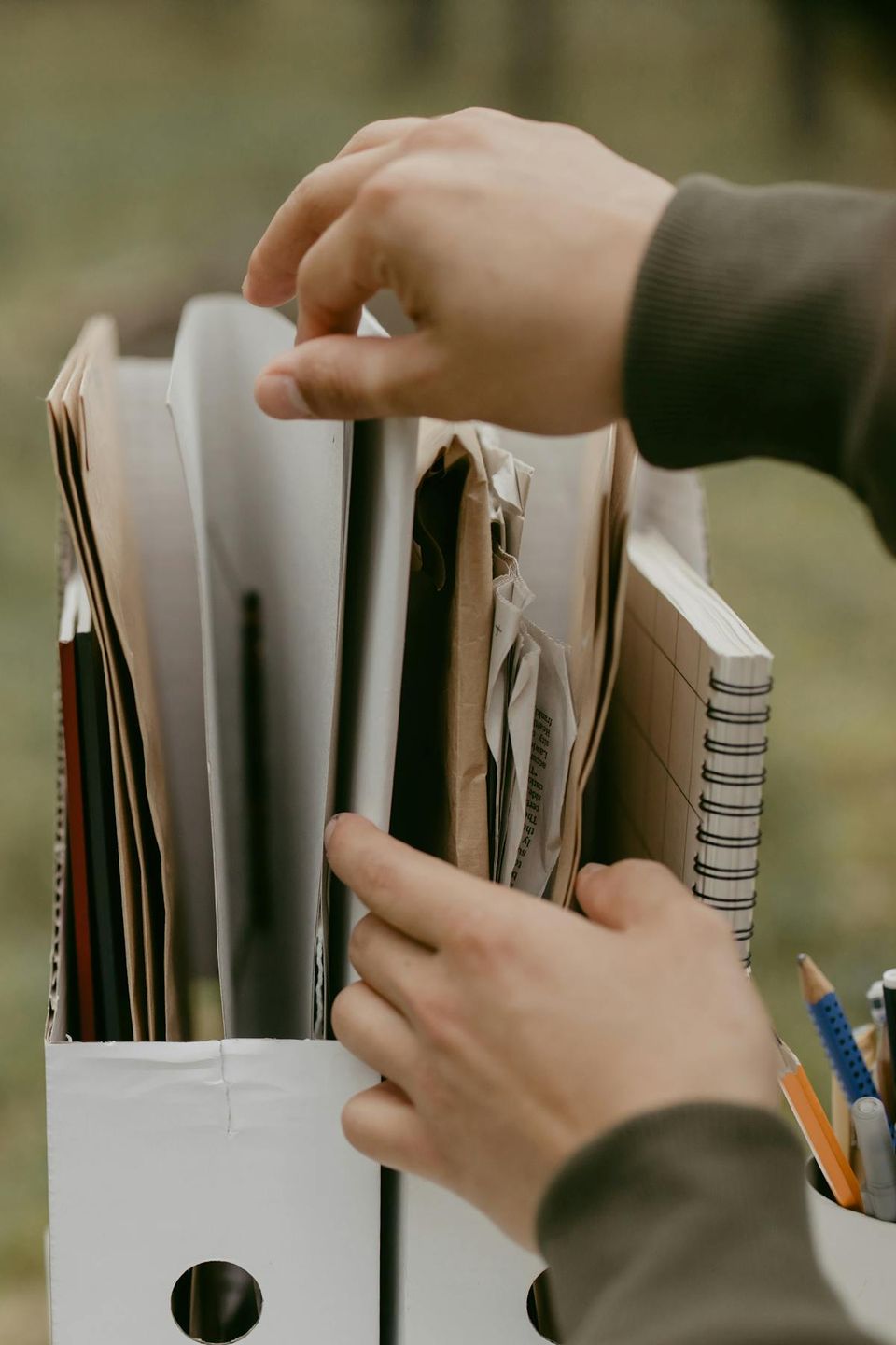 Organized paperwork and document folders on a desk during first month of homeownership