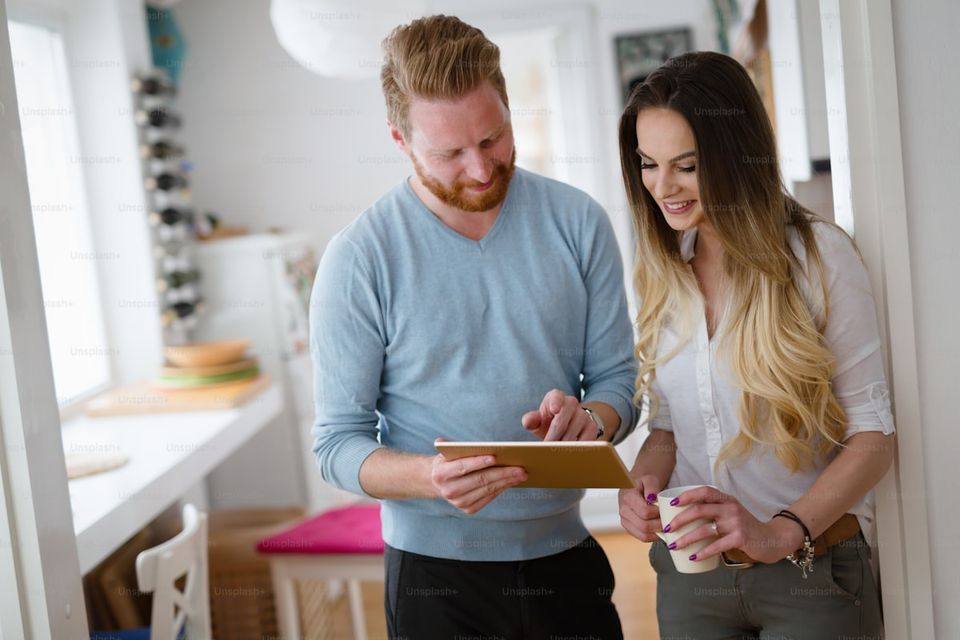 Buyer reviewing home documentation package at kitchen table