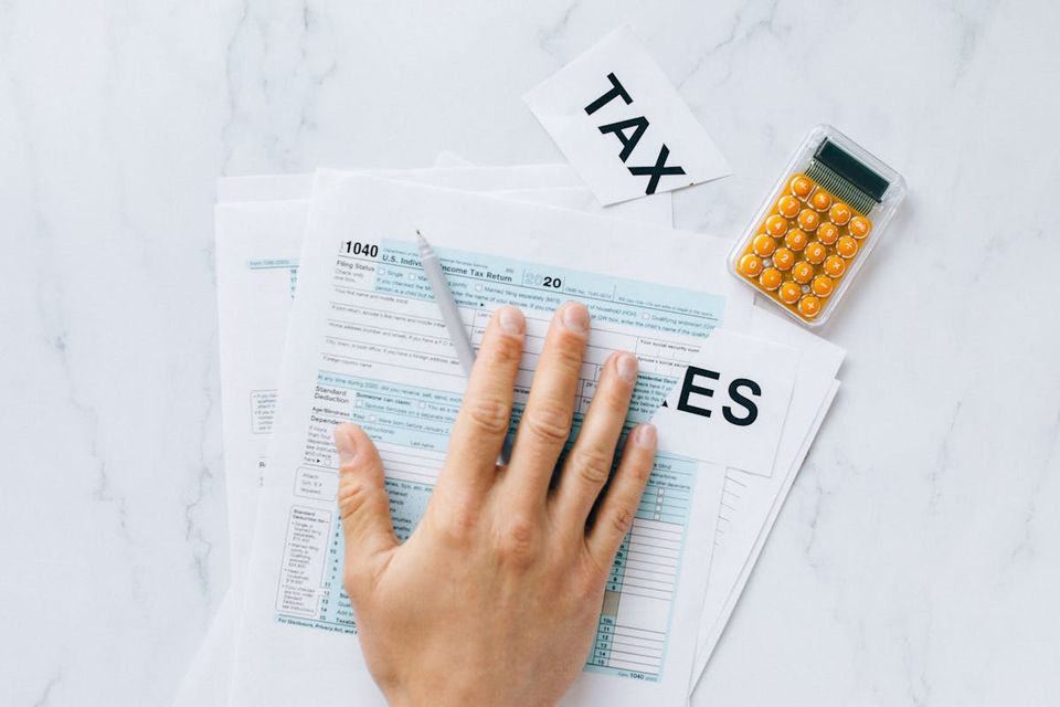 Landlord organizing tenant files and maintenance records in a per-property digital filing system