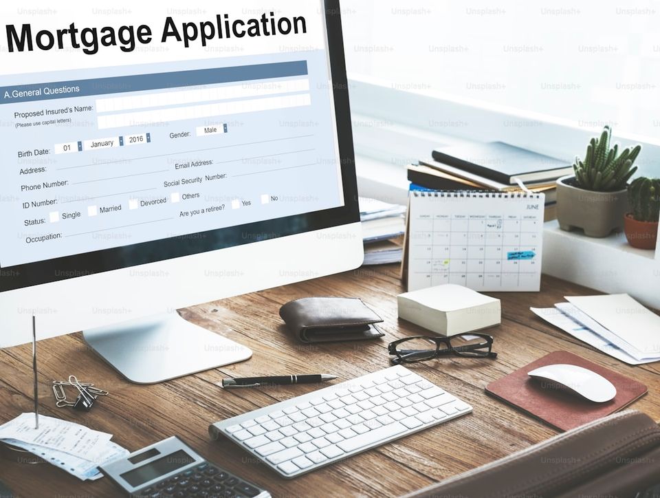 Mortgage application documents organized by category in folders