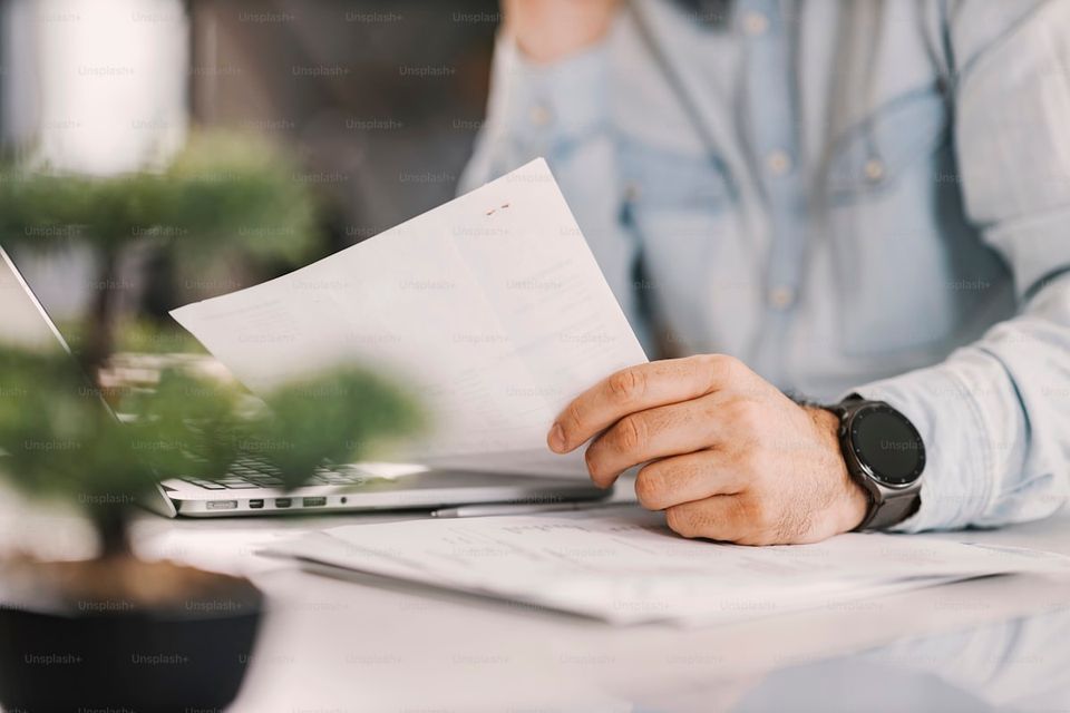 Seller reviewing disclosure documents before listing a home