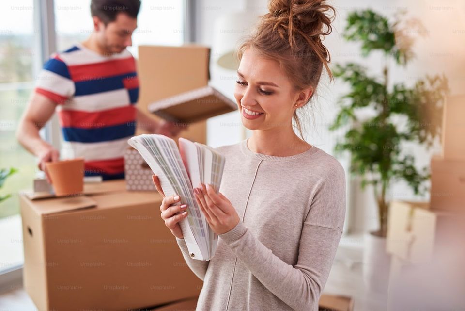 Homeowner organizing property sale documents in a folder
