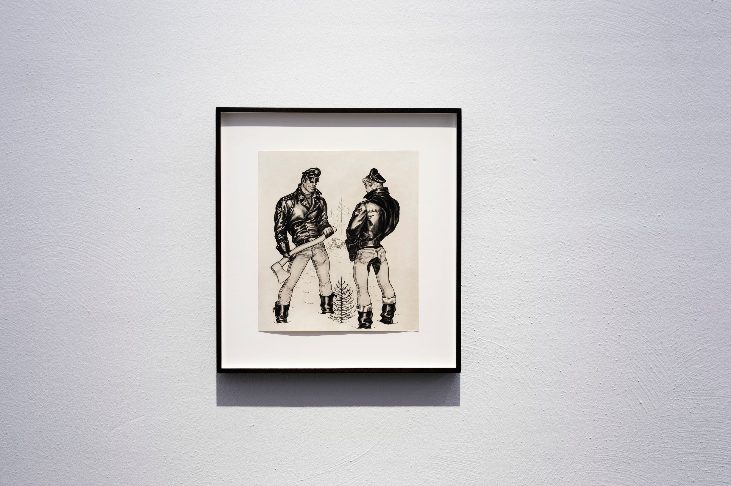 Kuv Tom of Finlandin teoksesta. Kuvassa kaksi mieshahmoa, toisella niistä kirves kädessä.