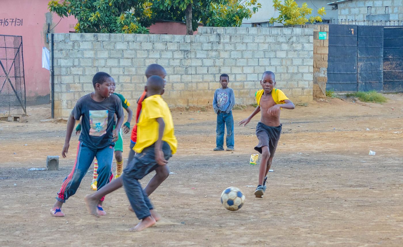Children playing football, illustrating school football in Nairobi