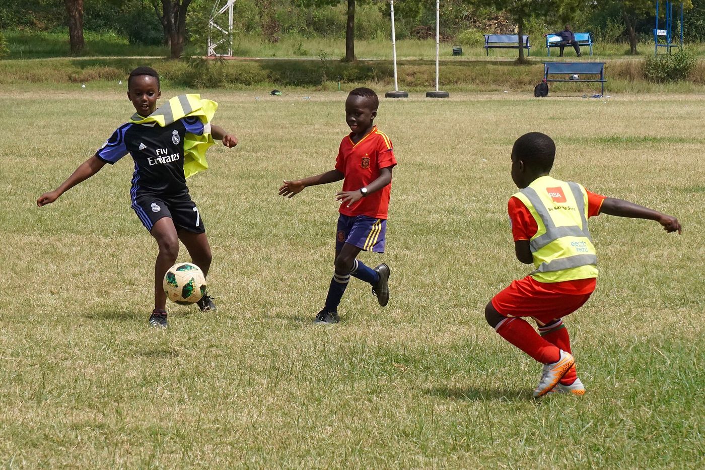 Young Kenyan boys playing a friendly football match