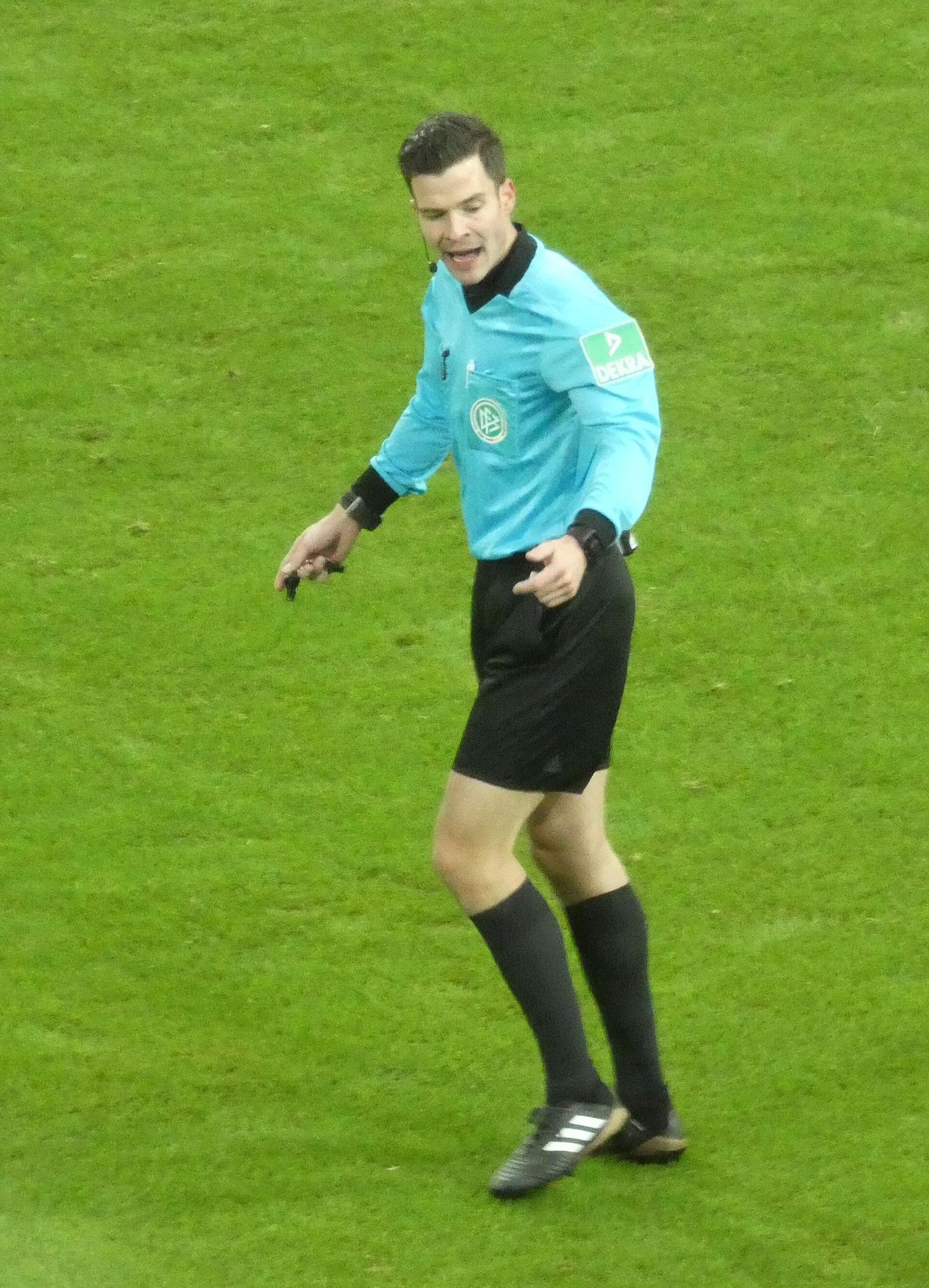 A football referee during a professional match